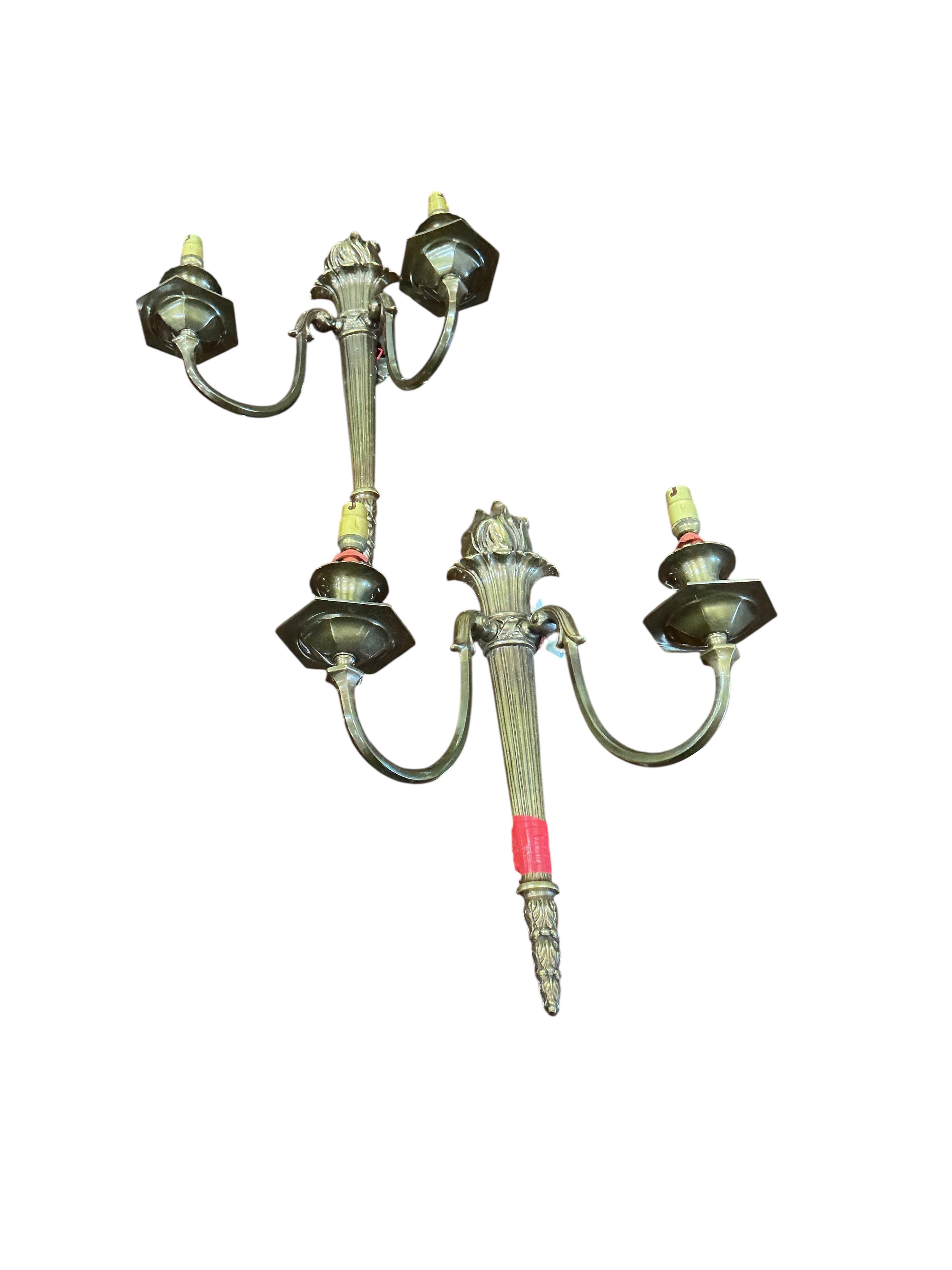 A set of four gilt metal twin branch wall lights with flambé finials and shades, height 41cm